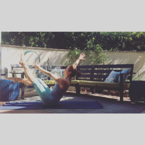 Navasana or Boat Pose with a Yoga Wheel for Strong Abs